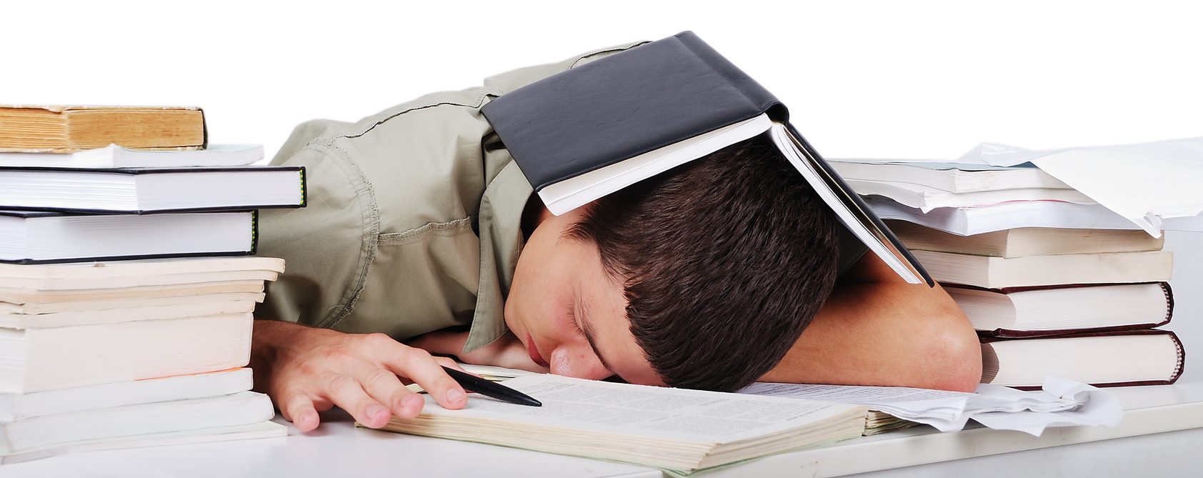 Young man fallen asleep after long reading