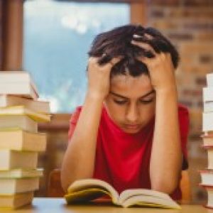 Tense Boy Reading Studying Books